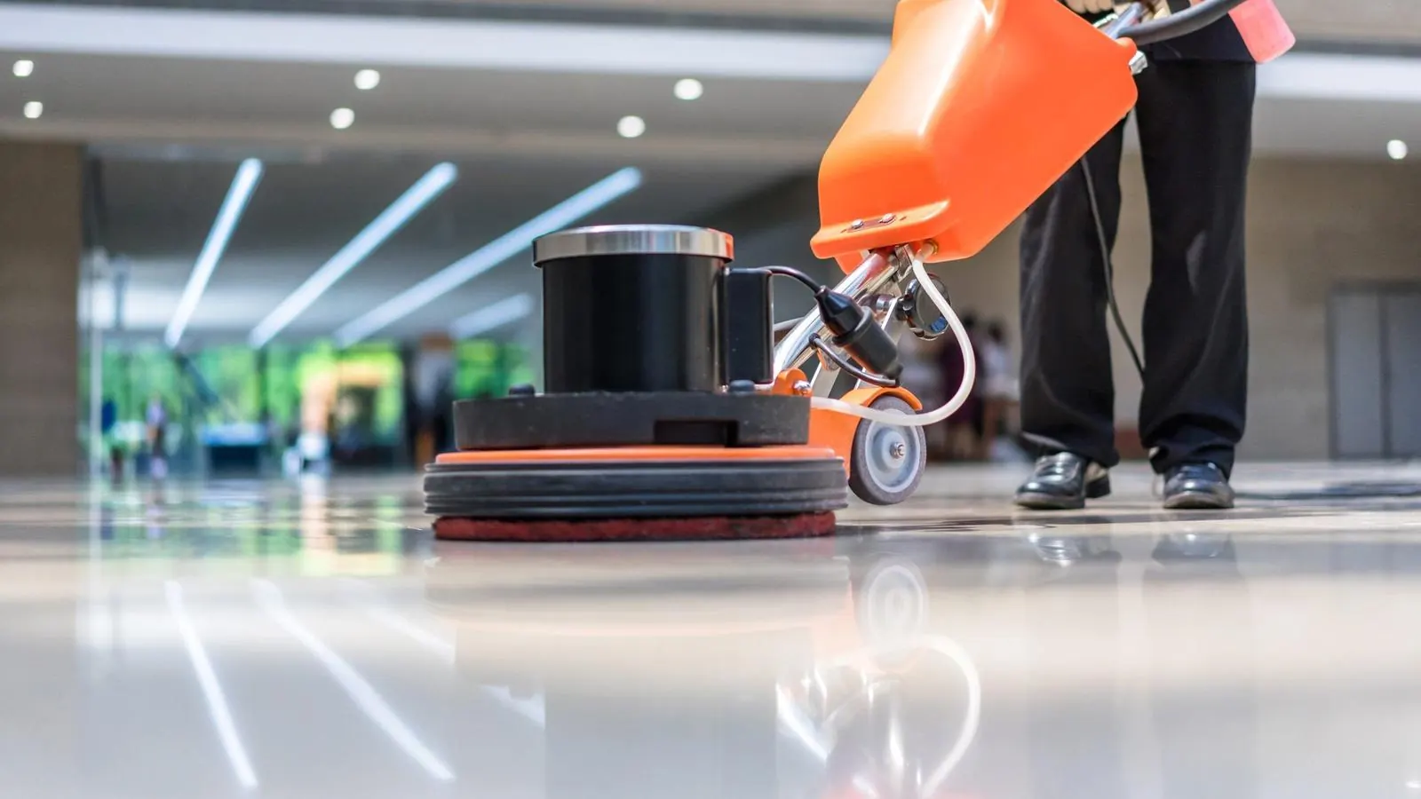 Floor buffer polishing a glossy office floor