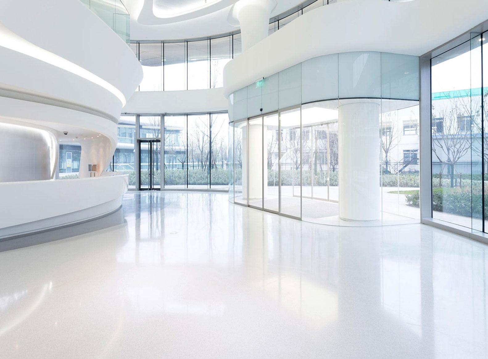 Spotless white office lobby with glass walls