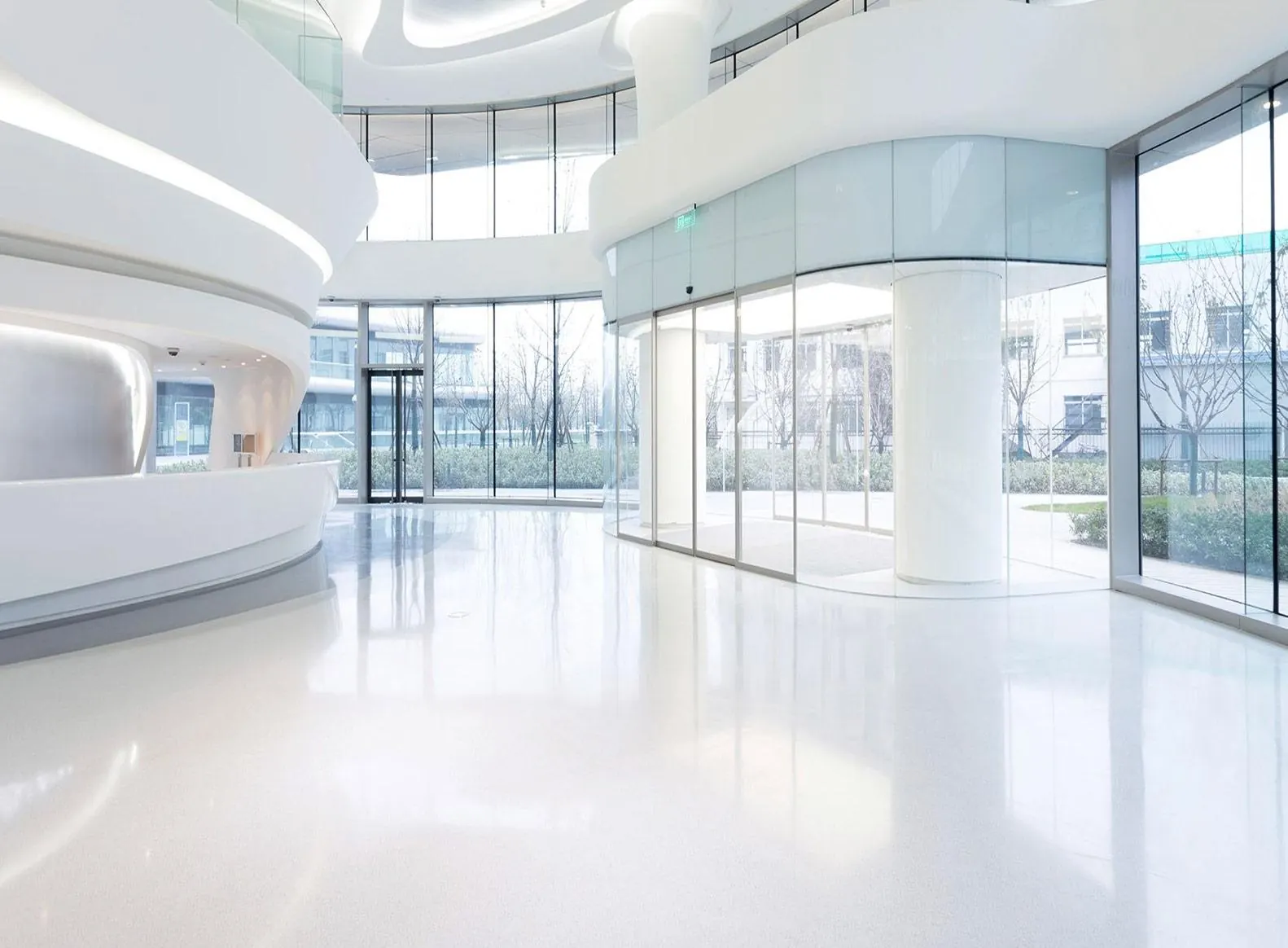 Spotless white office lobby with glass walls
